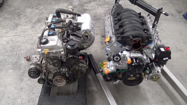 GM LSx V8 and 4L80E automatic transmission next to Toyota 2RZ-FE inline-four and automatic transmission