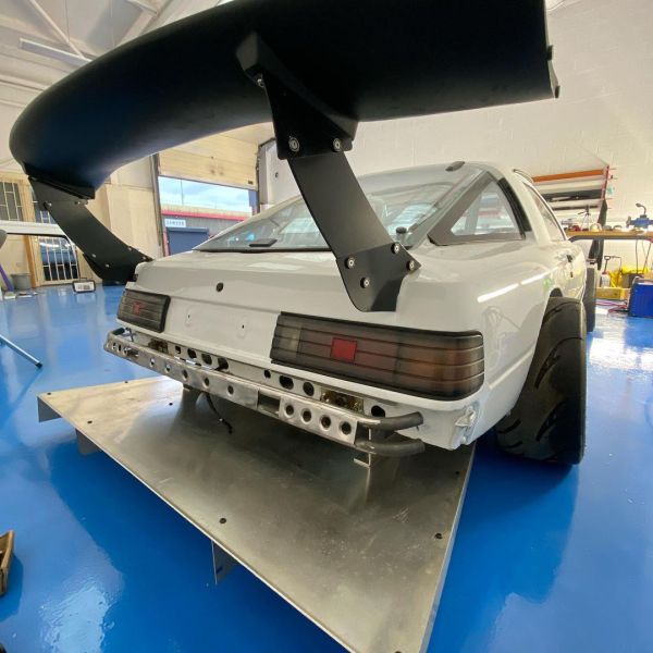 Mazda RX-7 built by Downforce Fabrication with a turbo K24 inline-four
